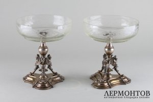 Парные вазы-фруктовницы на ножках в виде грифонов. Серебро 800 пробы. Австрия.