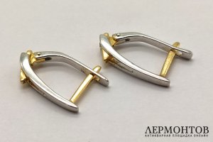 Серьги с английским замком из двухцветного золота 750 пробы с 2 бриллиантами.