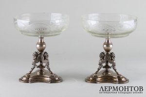 Парные вазы-фруктовницы на ножках в виде грифонов. Серебро 800 пробы. Австрия.
