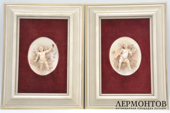 Парные фарфоровые пласты с изображениями херувимов, путти. Германия, середина XIX века.