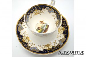 Фарфор, полихромная роспись, крытье кобальтом, золочение.  Высота чашки 7,8 см. Диаметр блюдца 14,8 см.   В хорошей сохранности.